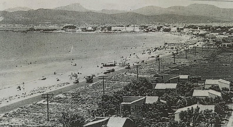 El Arenal Beach, located on the beautiful island of Mallorca, Spain, is known for its expansive sandy shores and clear waters. This vintage photograph captures an era when the beachfront was dotted with fewer buildings and less commercial development, highlighting the natural beauty and serene atmosphere of the past. 1485078972683-e6edae3b-2c71-4e67-bbf5-abfb8501ec42.jpg