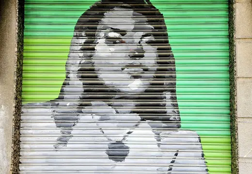 Woman’s Face on a Green Shutter in Palma