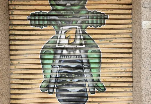 Green Figure Graffiti on a Palma Shutter