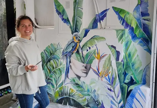 Woman Beside Tropical SodaPop Mural