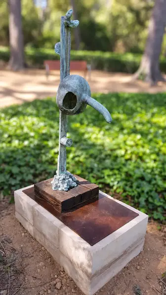 Blue-Green Sculpture in Softly Blurred Park.webp